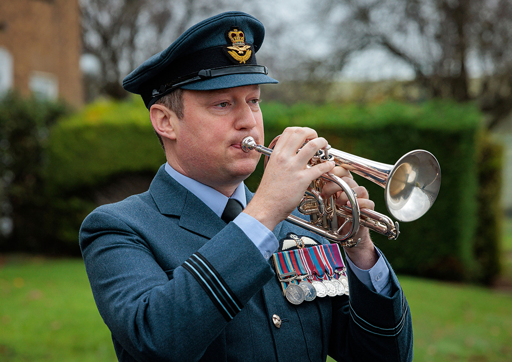 A bugler plays the Last Post during the Station Act of Remembrance.